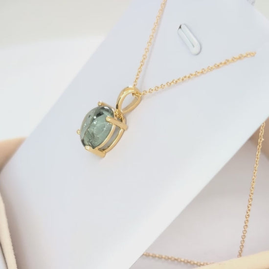 green tourmaline oval cabochon necklace in yellow gold