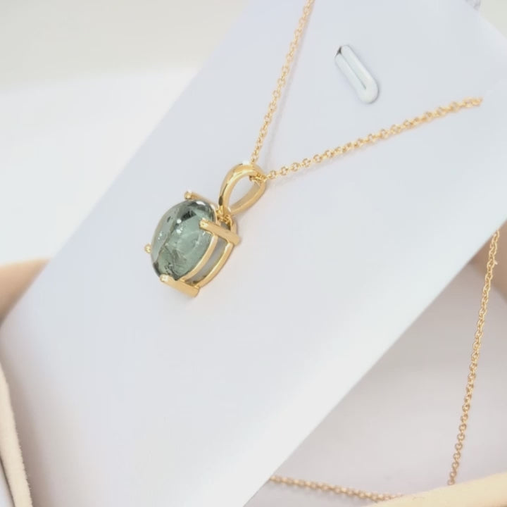 green tourmaline oval cabochon necklace in yellow gold