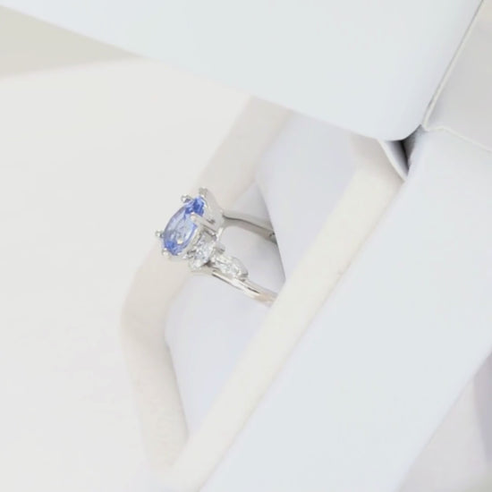 saige bypass ring in white gold with light blue lab sapphire pear