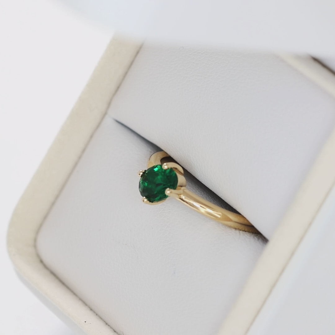 compass set solitaire ring in yellow gold with oval lab emerald