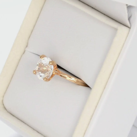 white lab sapphire round solitaire engagement ring in rose gold
