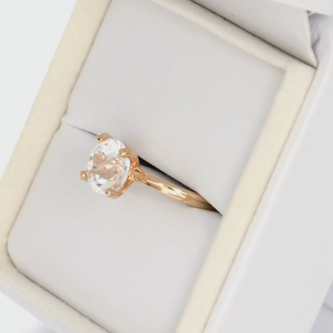 white lab sapphire round solitaire engagement ring in rose gold