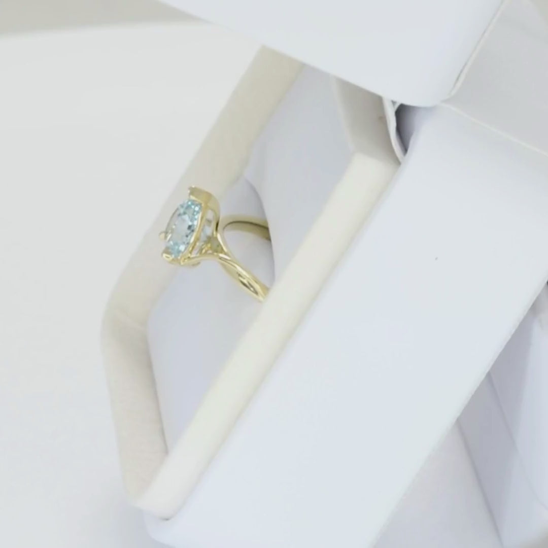 liyana solitaire ring in yellow gold with light blue lab sapphire pear