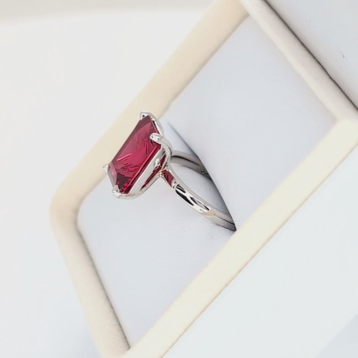 cali solitaire ring with step cut lab ruby
