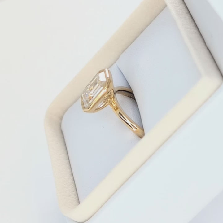 cami bezel set solitaire with step cut moissanite