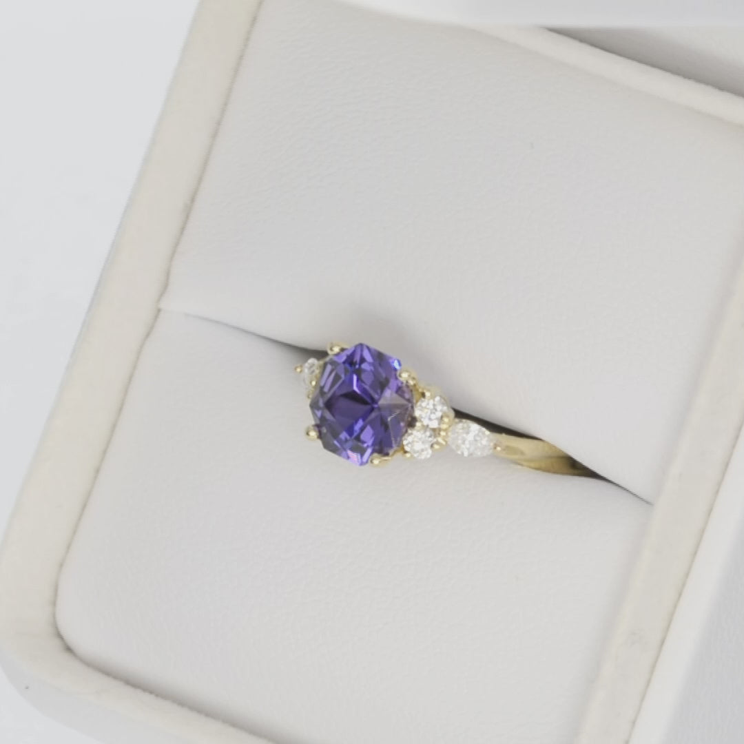 accented engagement ring with purple lab sapphire in yellow gold