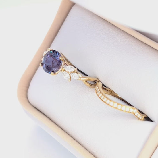 modified fifer wedding set in yellow gold with a round lab alexandrite 