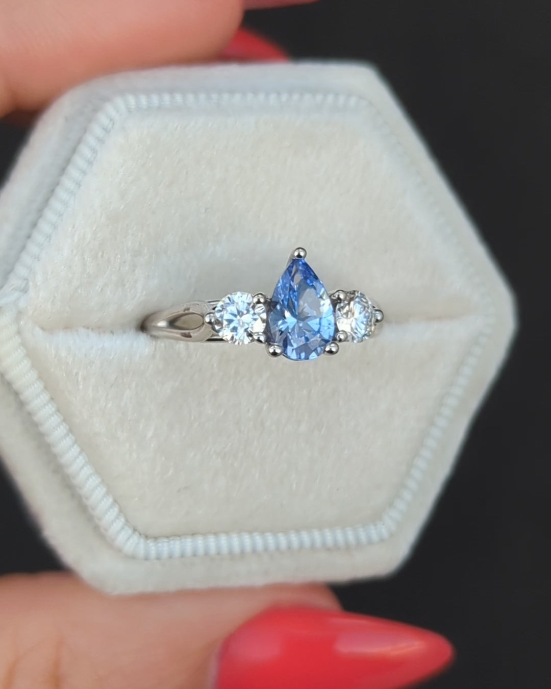 pear three stone engagement ring with lab sapphire