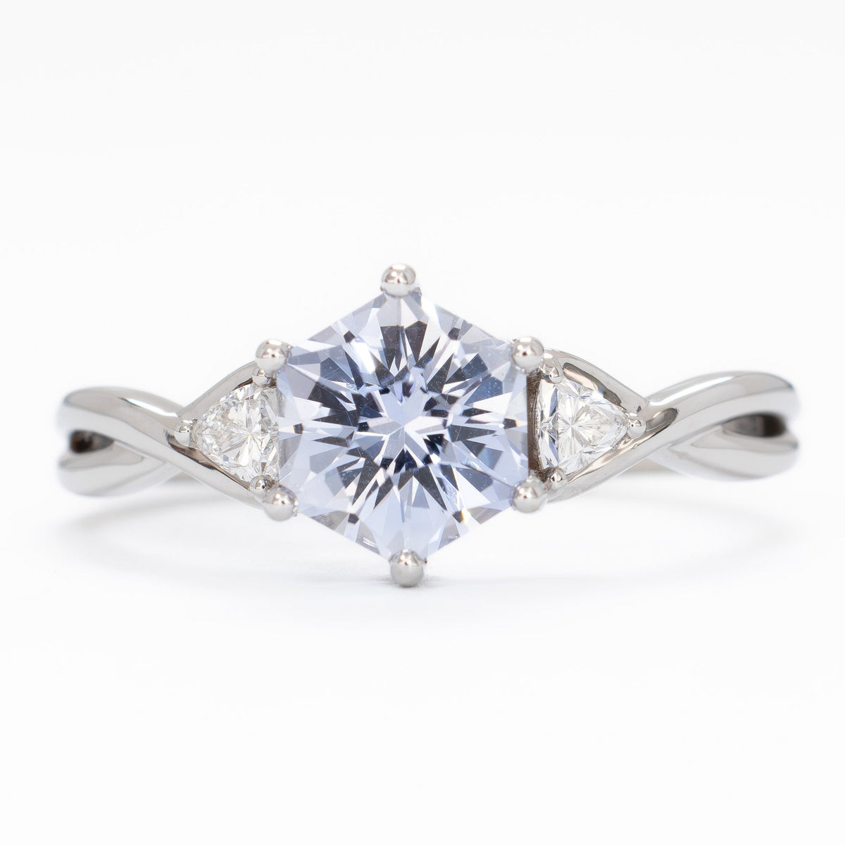 rosa three stone ring in white gold with light blue lab sapphire hex
