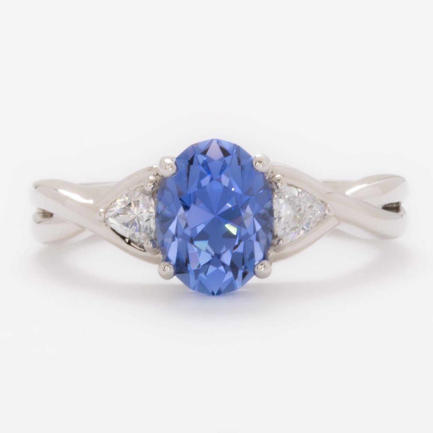 rosa three stone ring with oval blue lab sapphire
