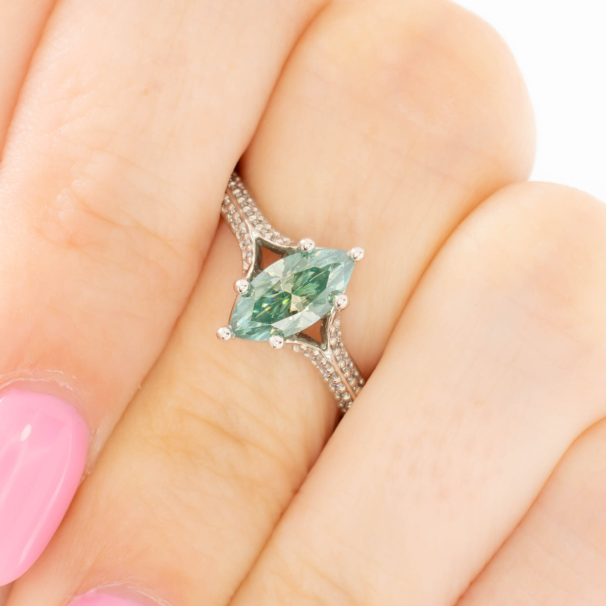 rosemary ring in silver with marquise green moissanite