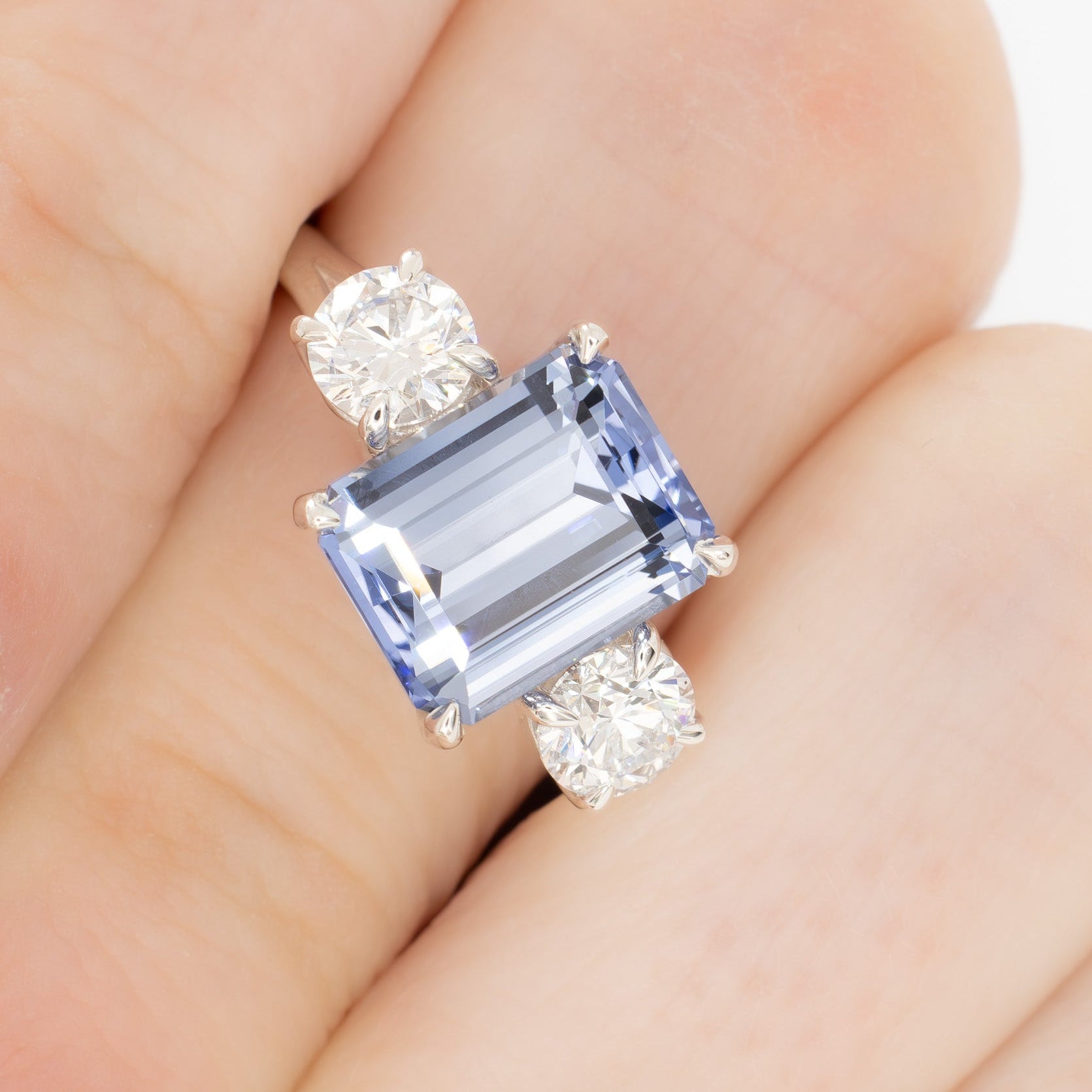 rylee three stone engagement ring with light blue lab sapphire step cut