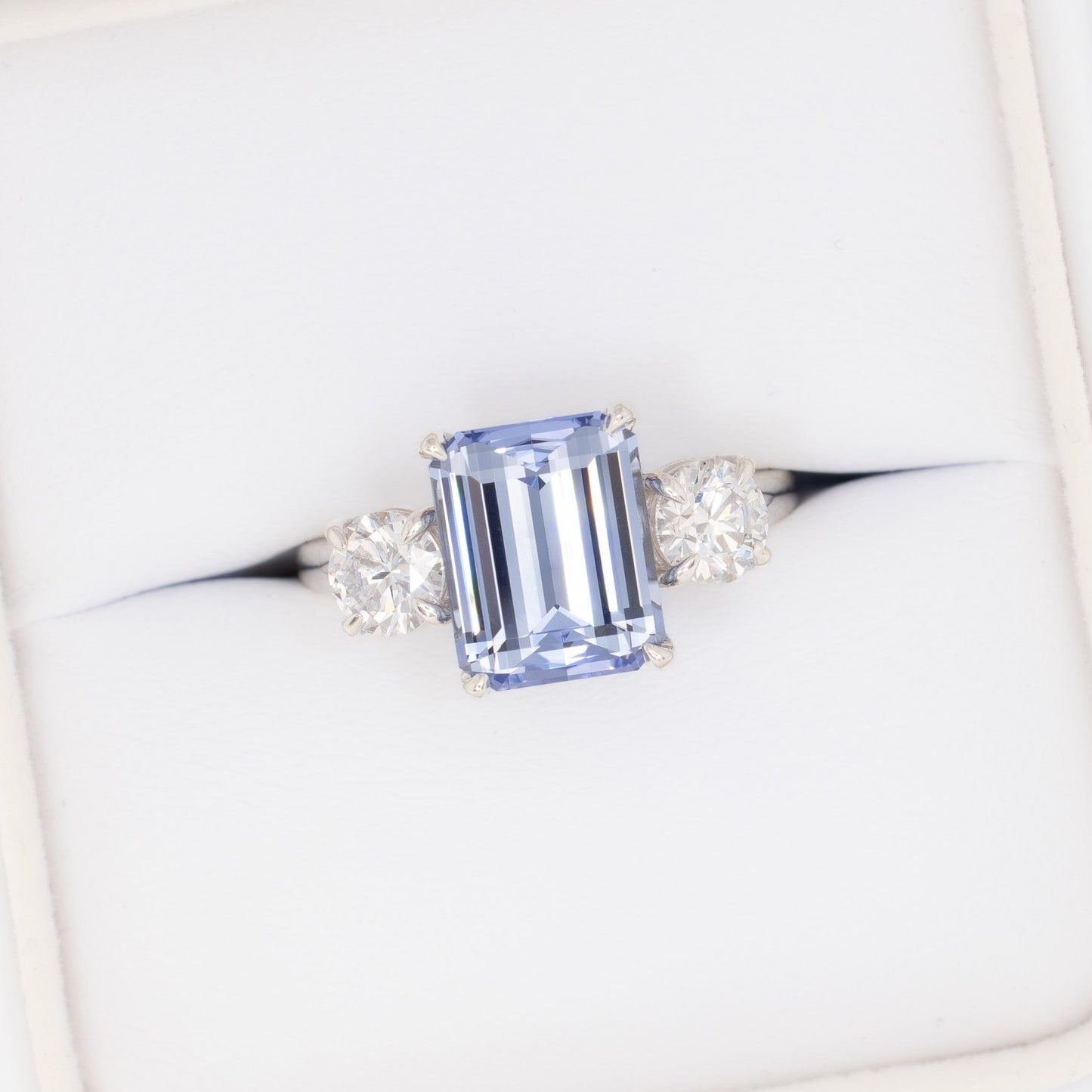 rylee three stone engagement ring with light blue lab sapphire step cut