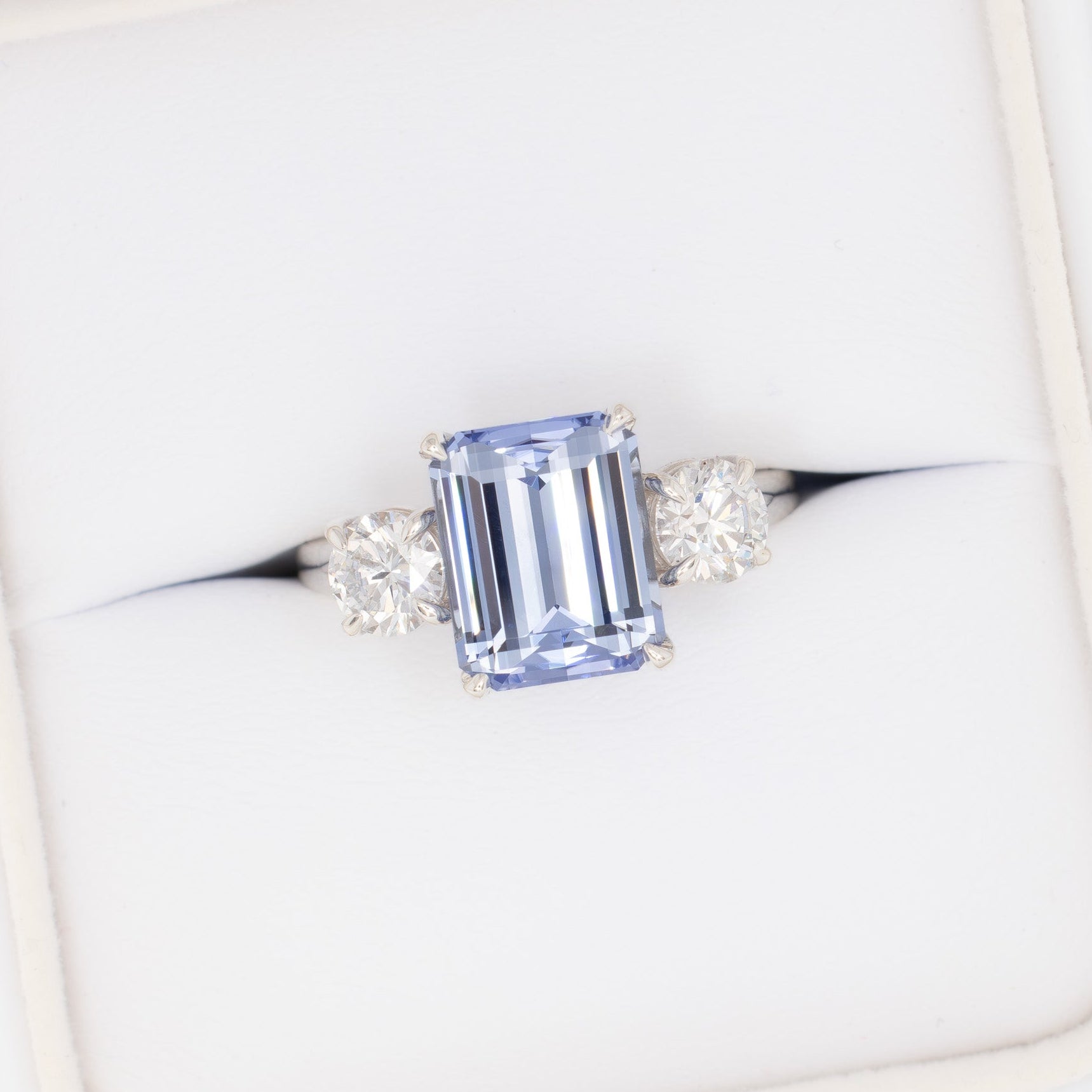 rylee three stone engagement ring with light blue lab sapphire step cut