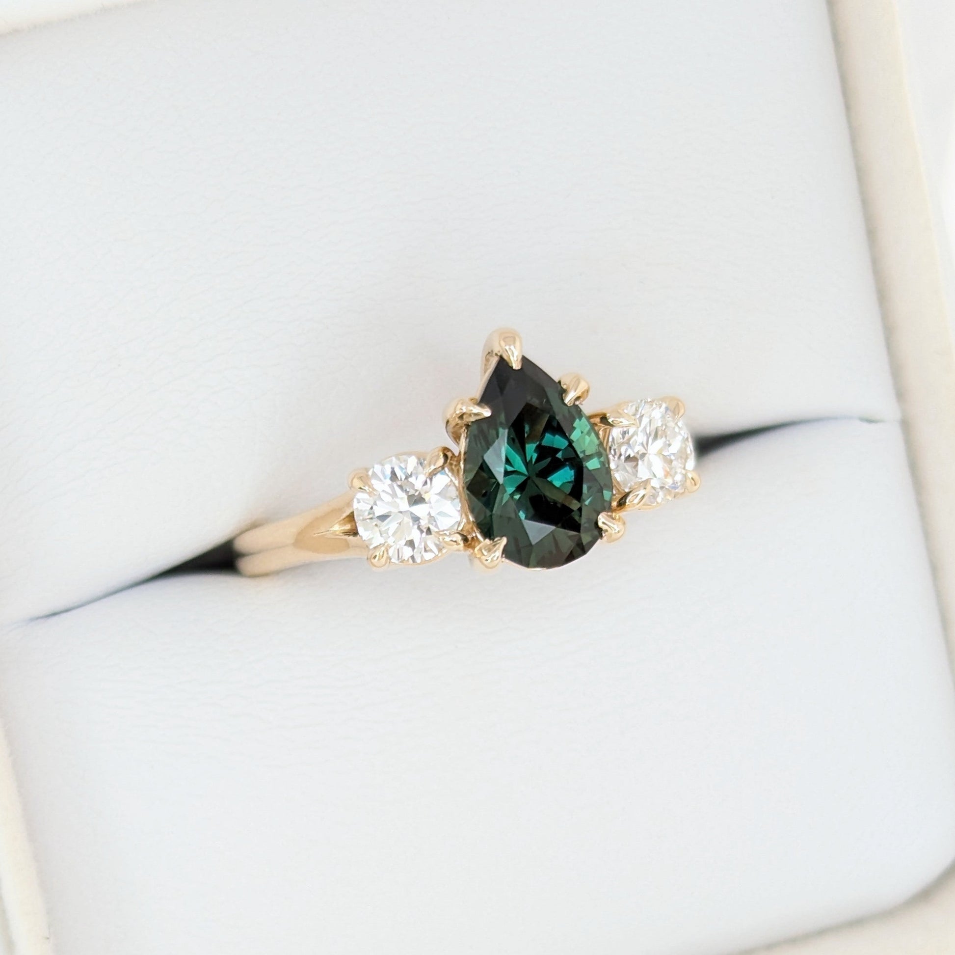 rylee three stone engagement ring with pear green lab sapphire