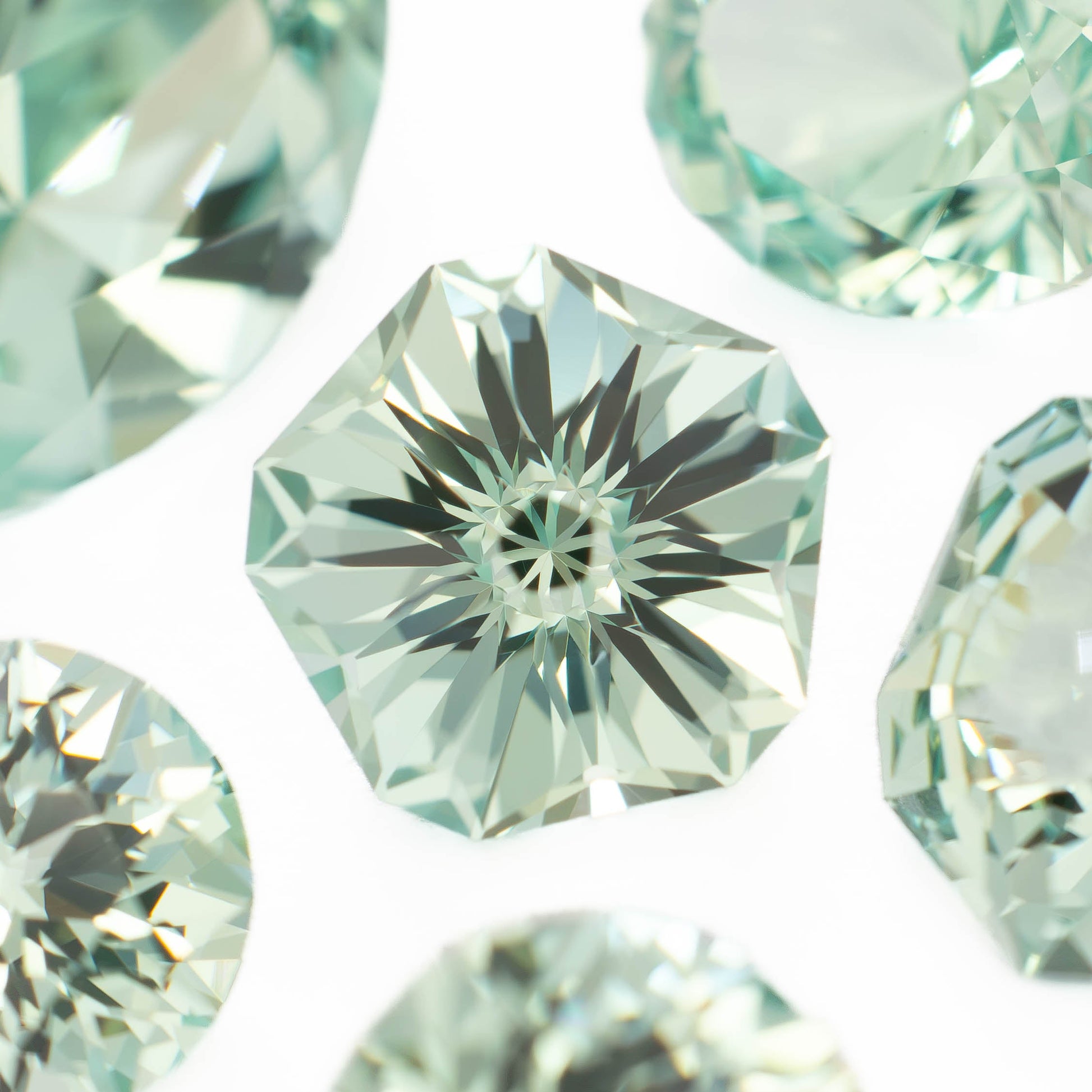 sage green lab sapphire in various cuts