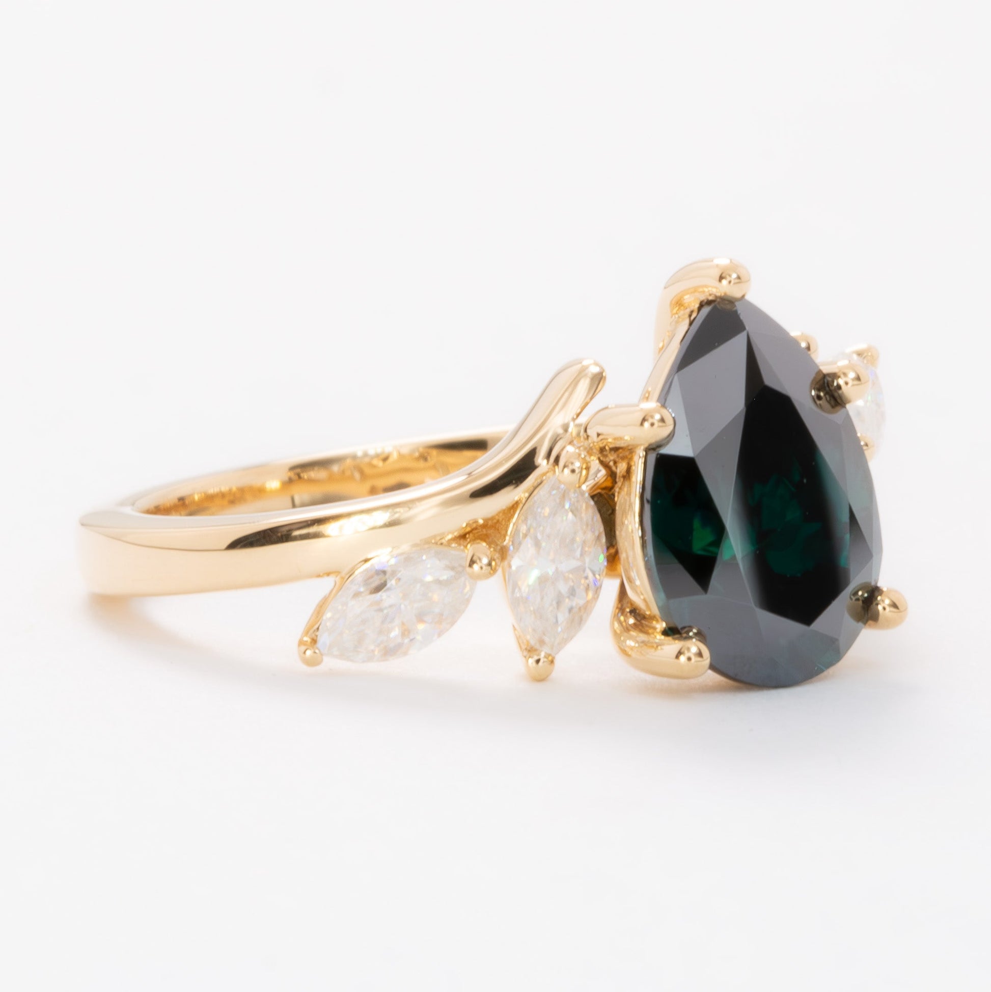 saige bypass ring with green moissanite pear