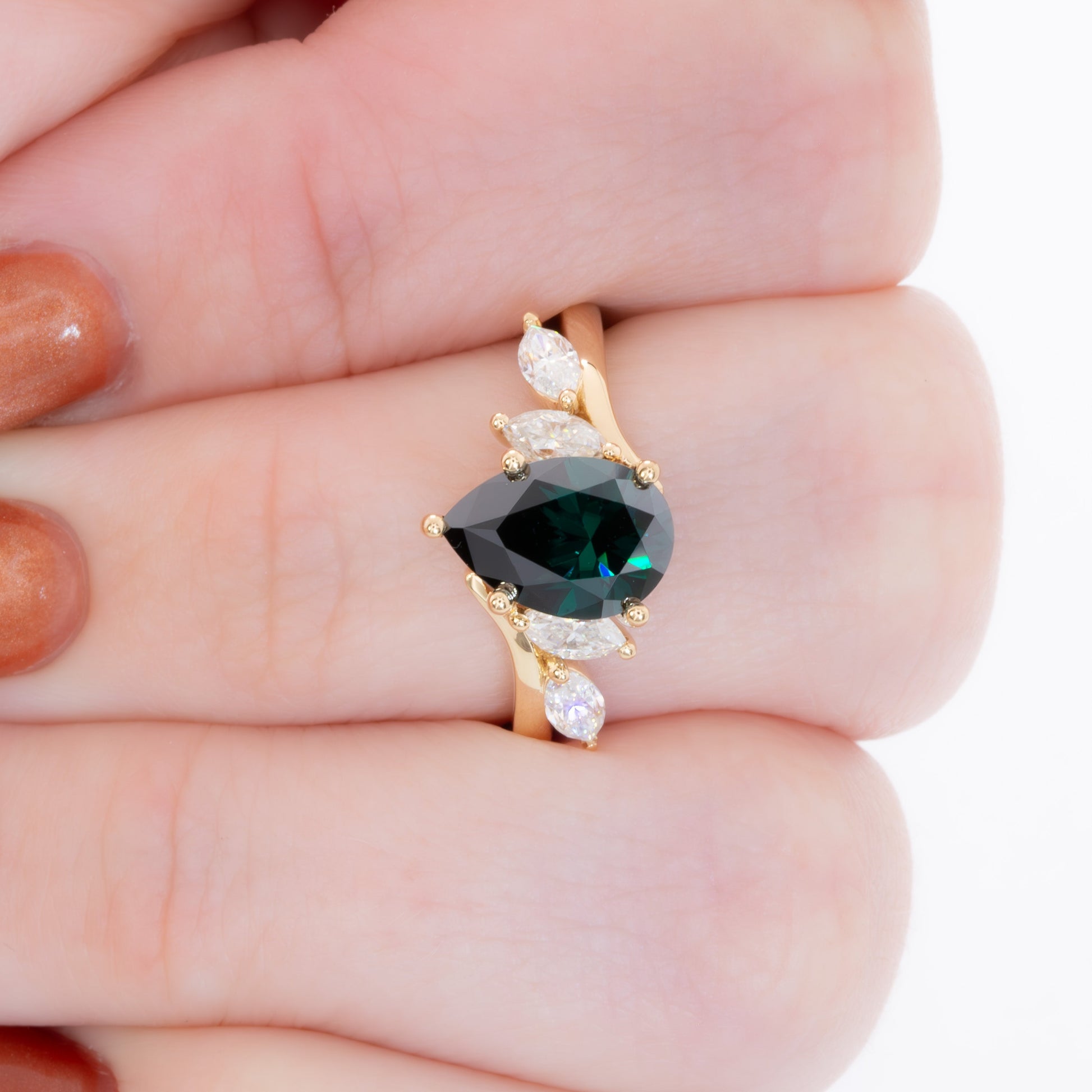 saige bypass ring with green moissanite pear