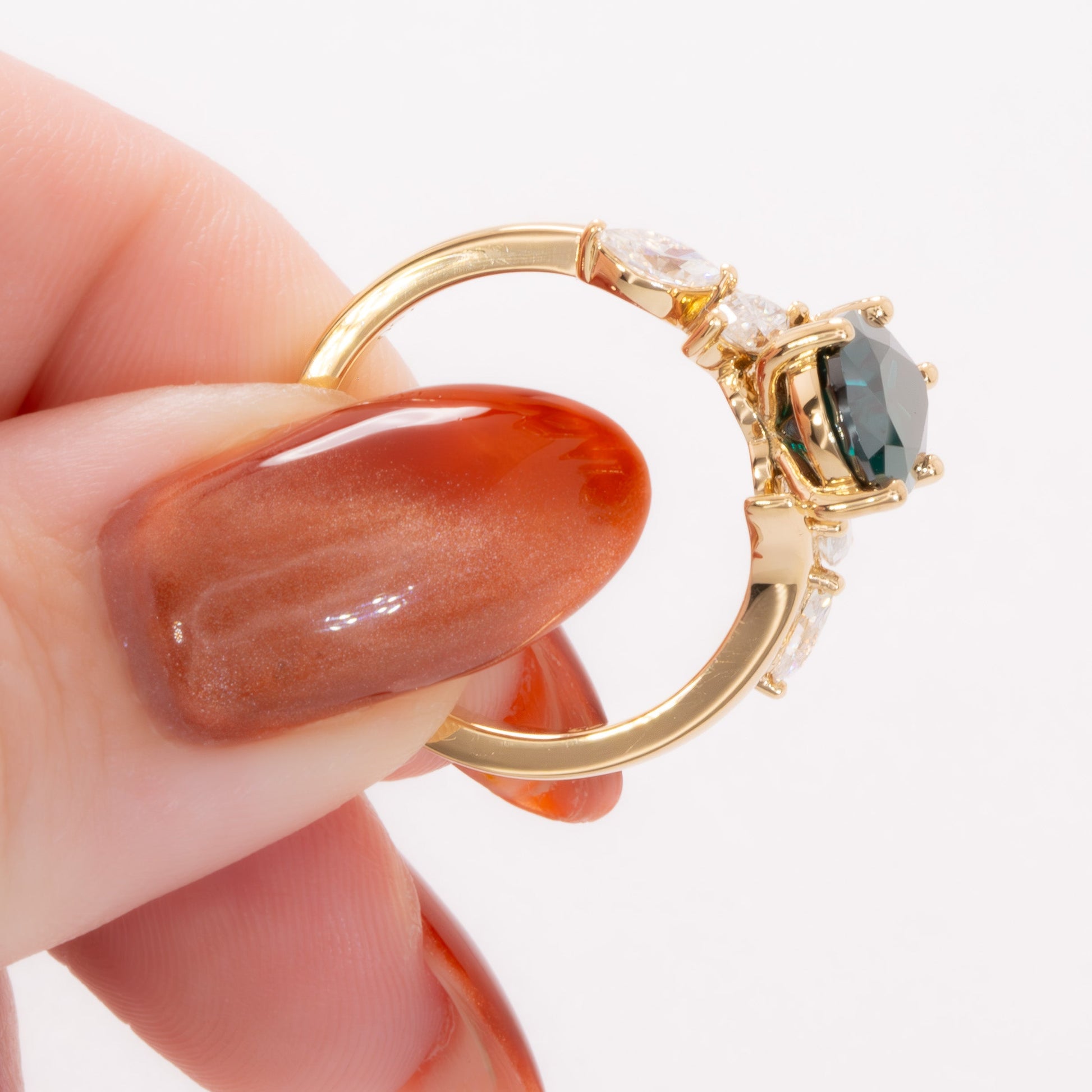 saige bypass ring with green moissanite pear