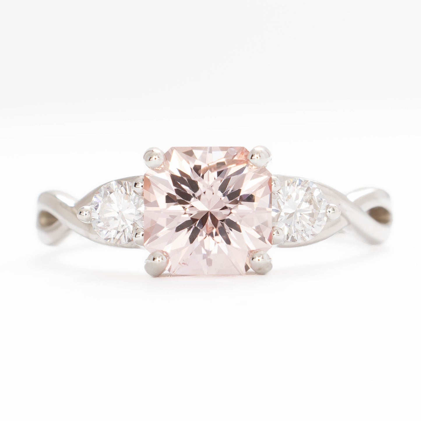 shasta three stone ring in silver with peach lab sapphire asscher