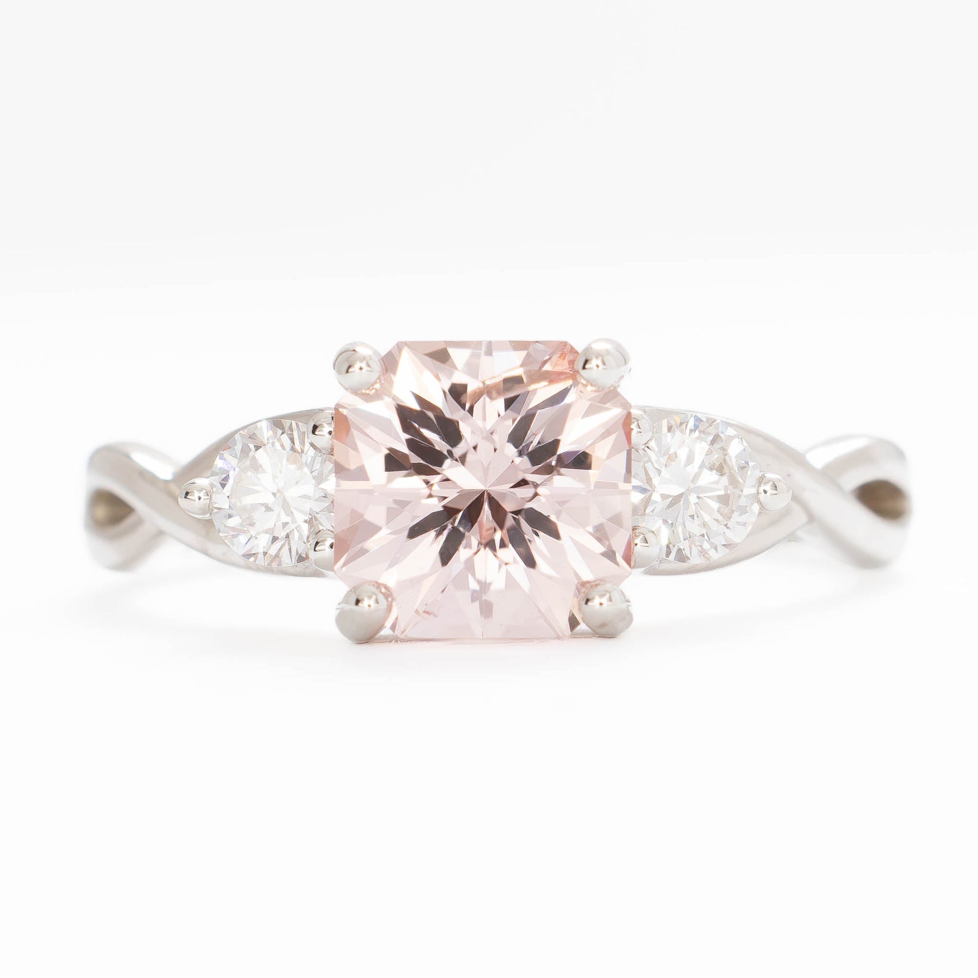 shasta three stone ring in silver with peach lab sapphire asscher