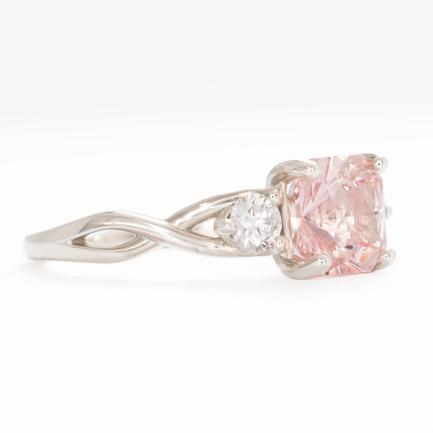 shasta three stone ring in silver with peach lab sapphire asscher