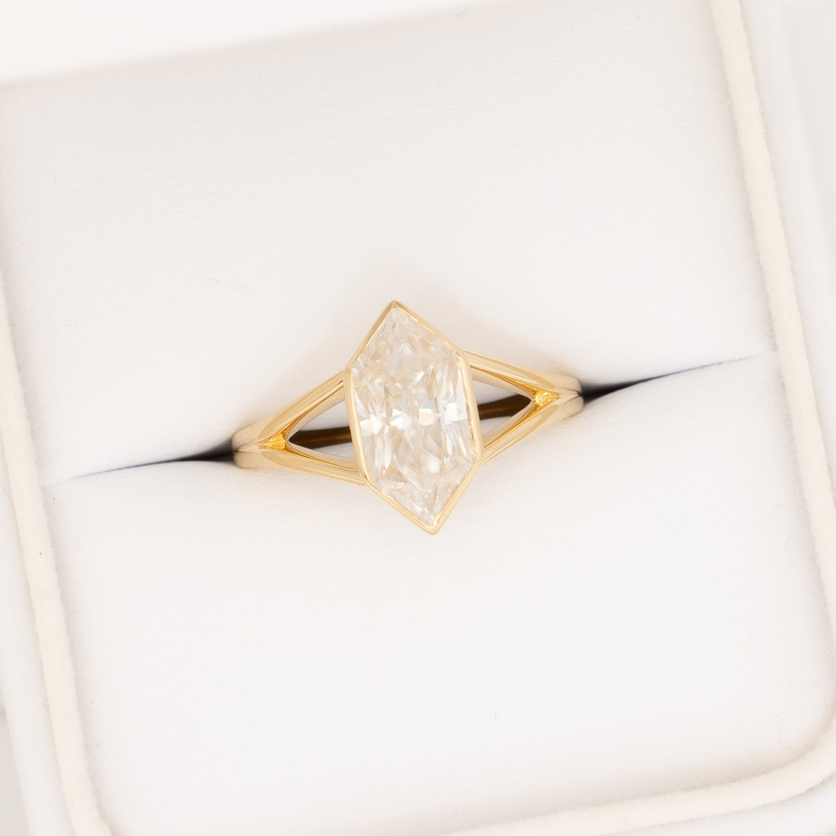 shion solitaire split shank ring in yellow gold with dutch marquise moissanite