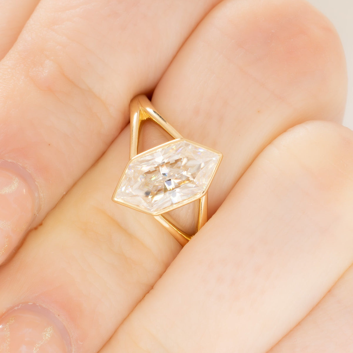 shion solitaire split shank ring in yellow gold with dutch marquise moissanite