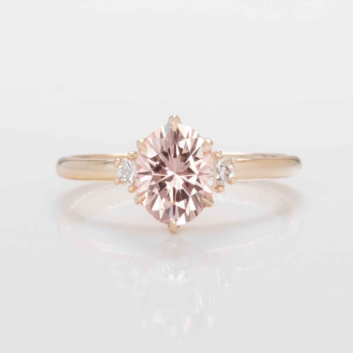 signy engagementring with oval peach lab sapphire