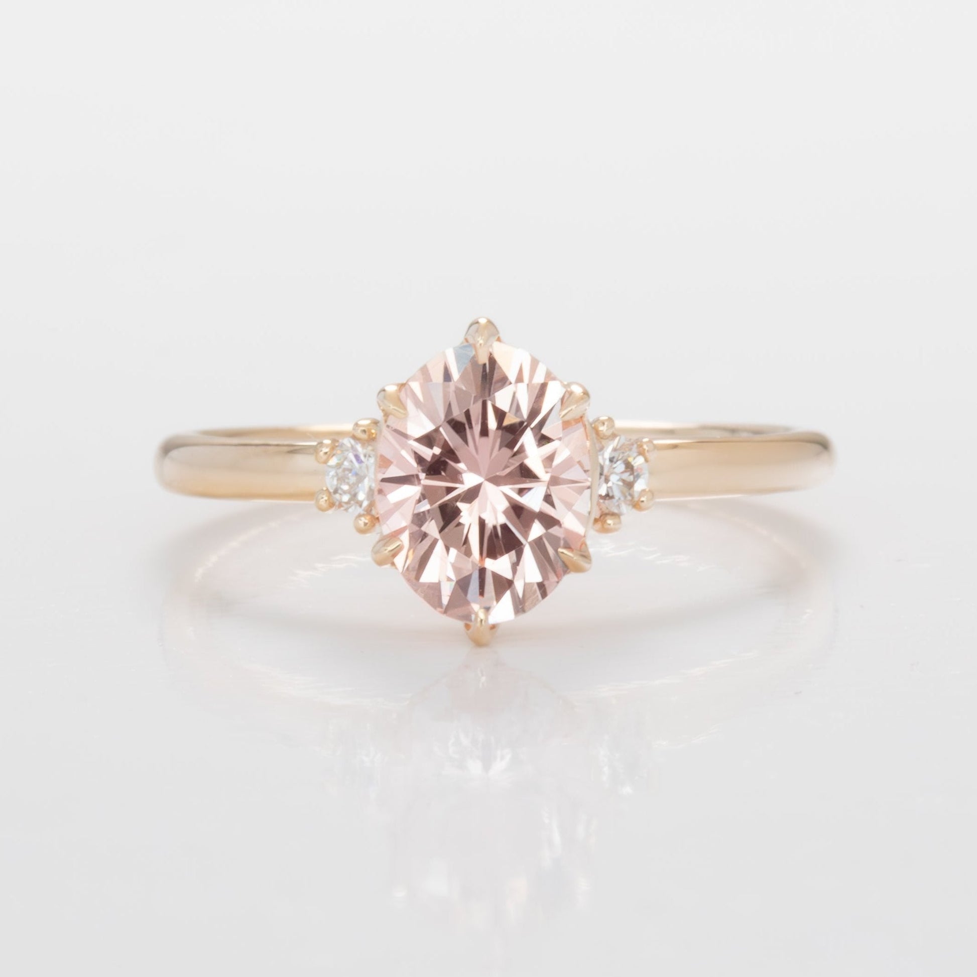 signy engagementring with oval peach lab sapphire