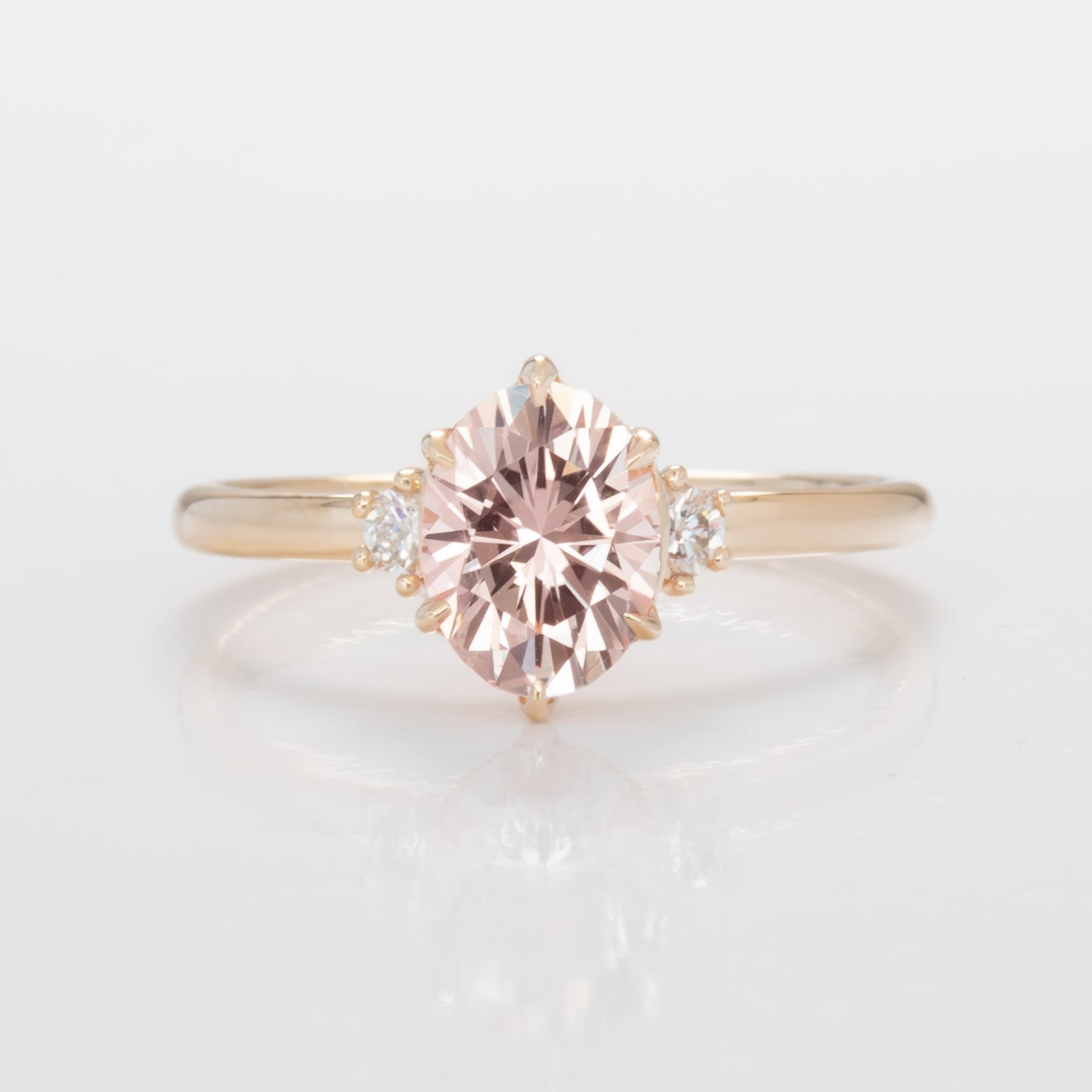 signy engagementring with oval peach lab sapphire