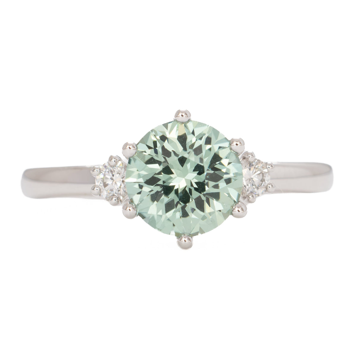 signy three stone ring in white gold with round green lab sapphire