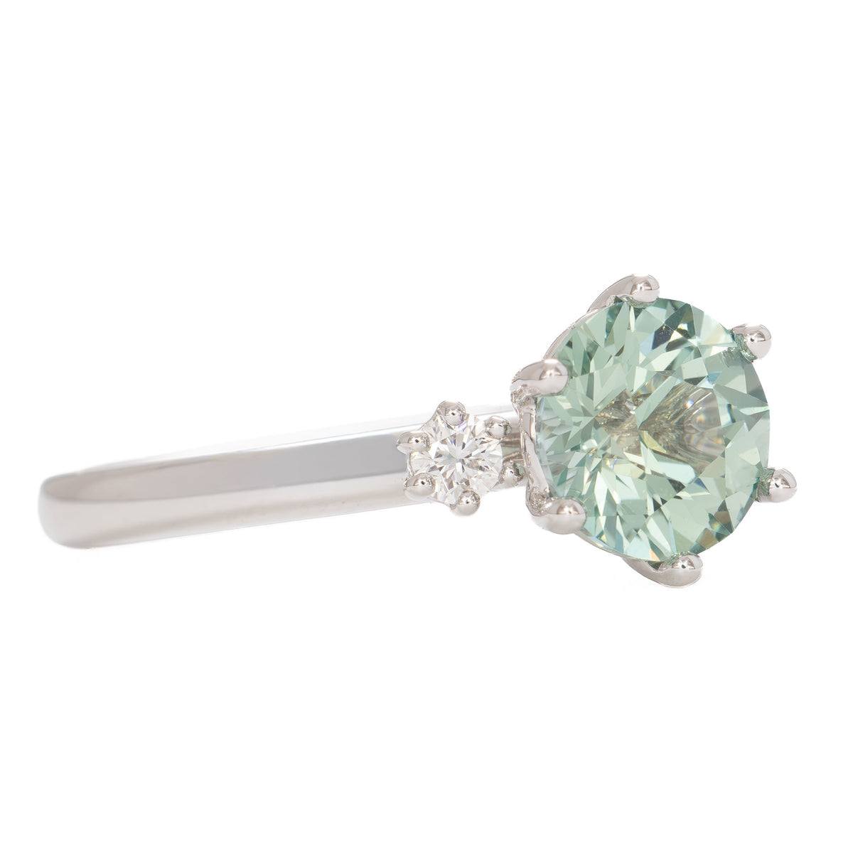 signy three stone ring in white gold with round green lab sapphire