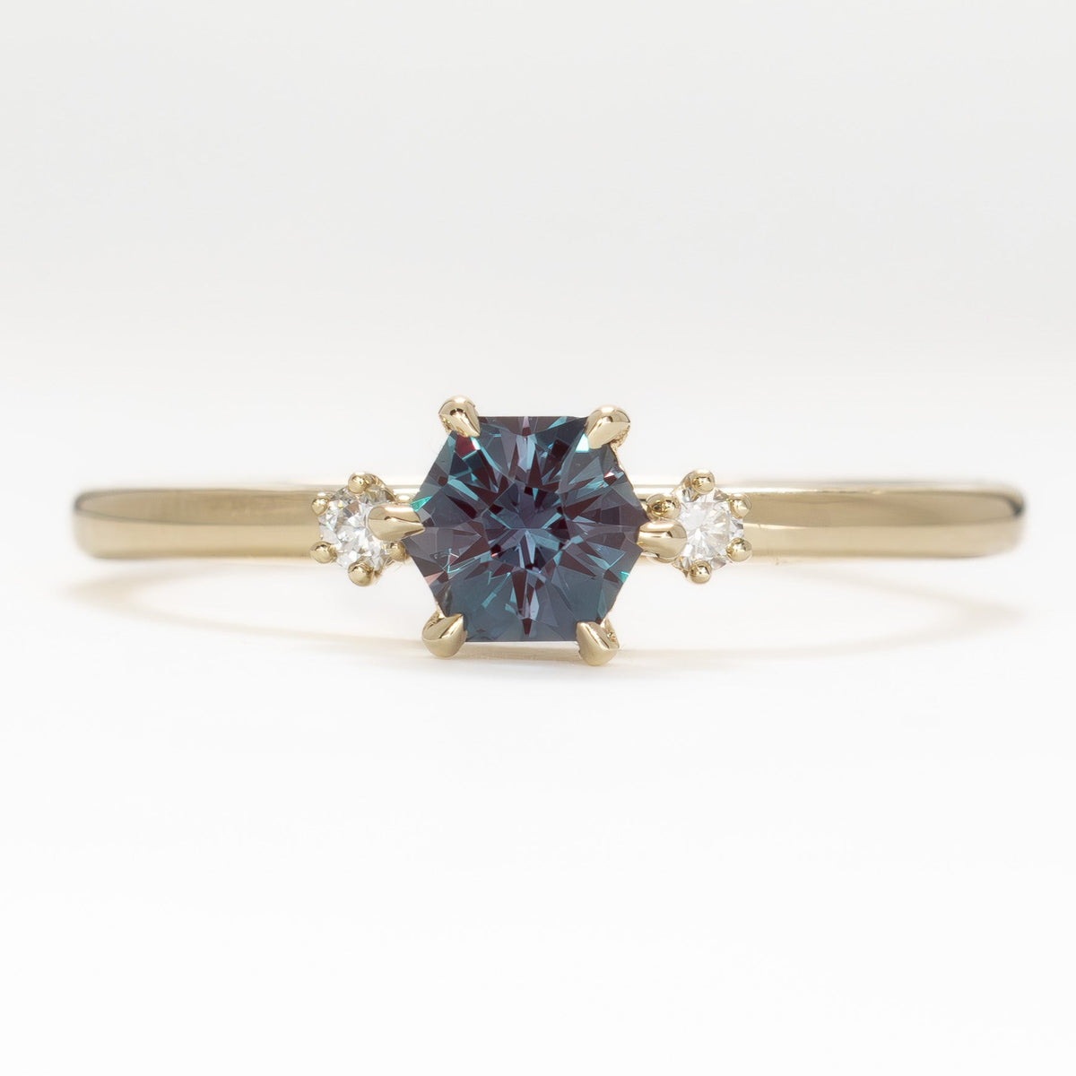 signy three stone ring in yellow gold with hex cut lab alexandrite