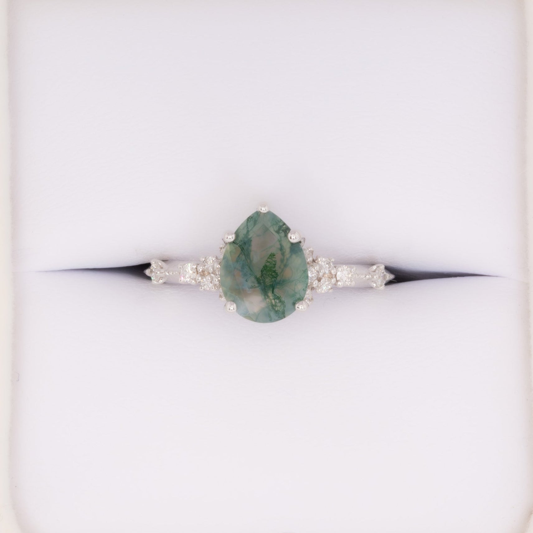 sloane engagement ring with moss agate pear