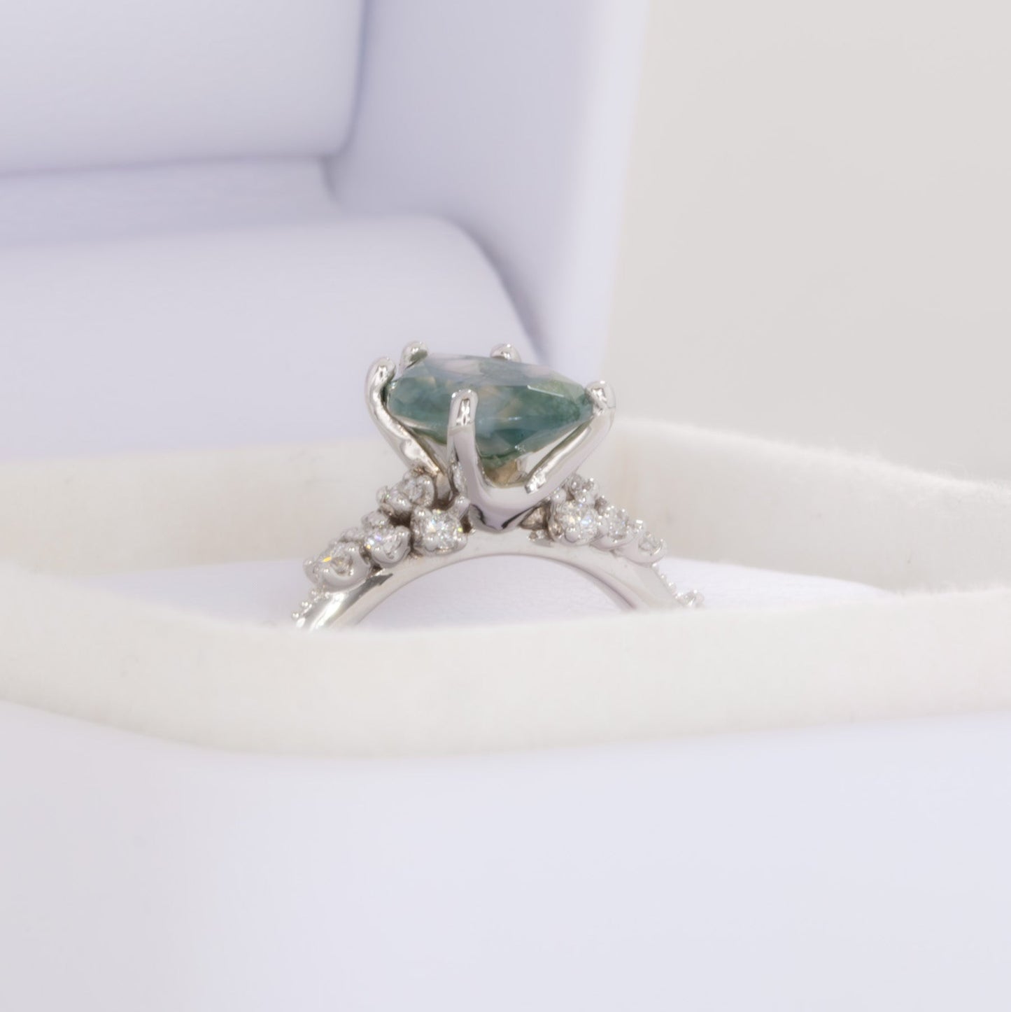 sloane engagement ring with moss agate pear