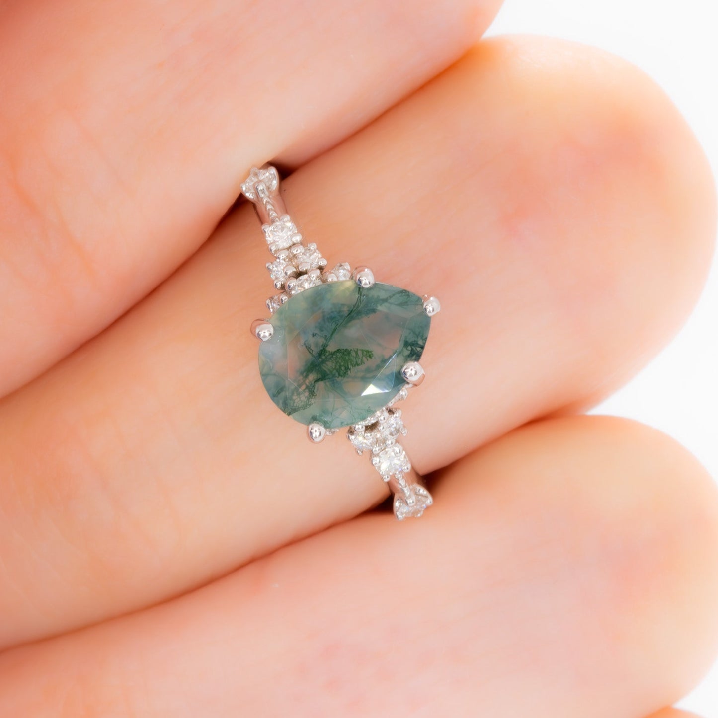 sloane engagement ring with moss agate pear