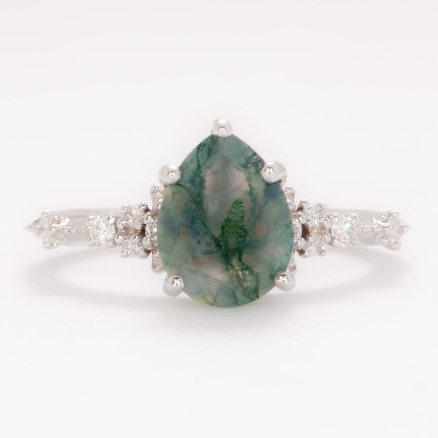 sloane engagement ring with moss agate pear