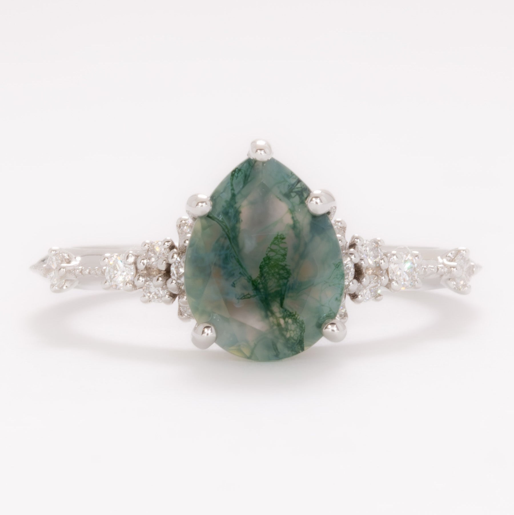 sloane engagement ring with moss agate pear