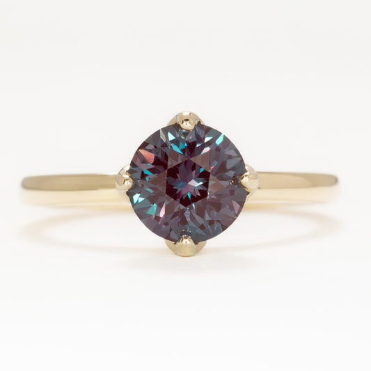 stasa solitaire engagement ring with round lab alexandrite in yellow gold