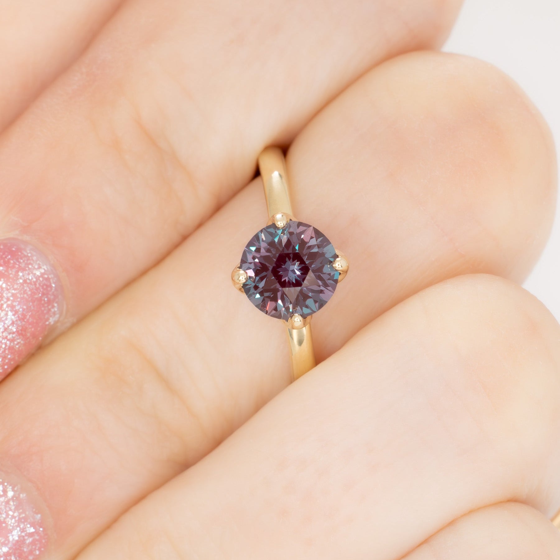 stasa solitaire engagement ring with round lab alexandrite in yellow gold
