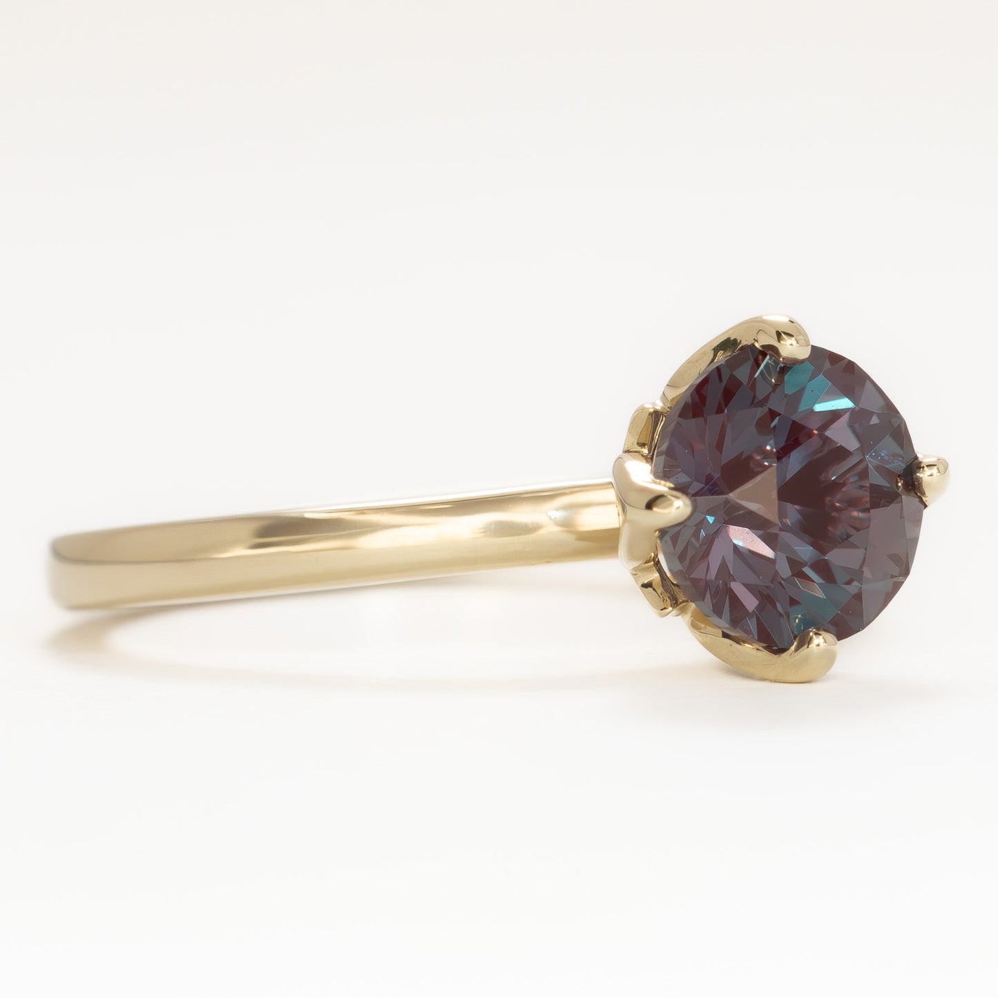 stasa solitaire engagement ring with round lab alexandrite in yellow gold