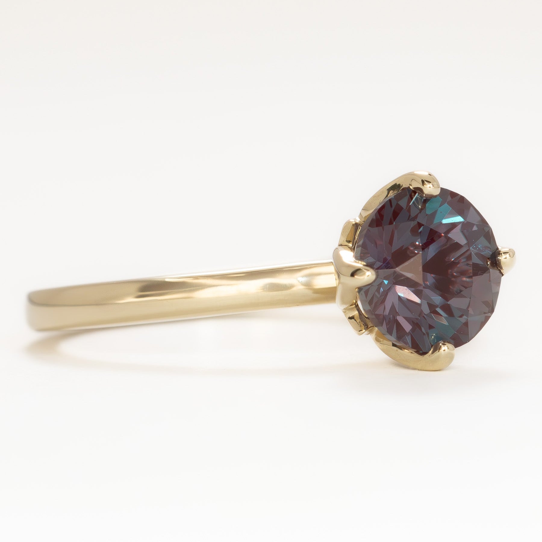 stasa solitaire engagement ring with round lab alexandrite in yellow gold