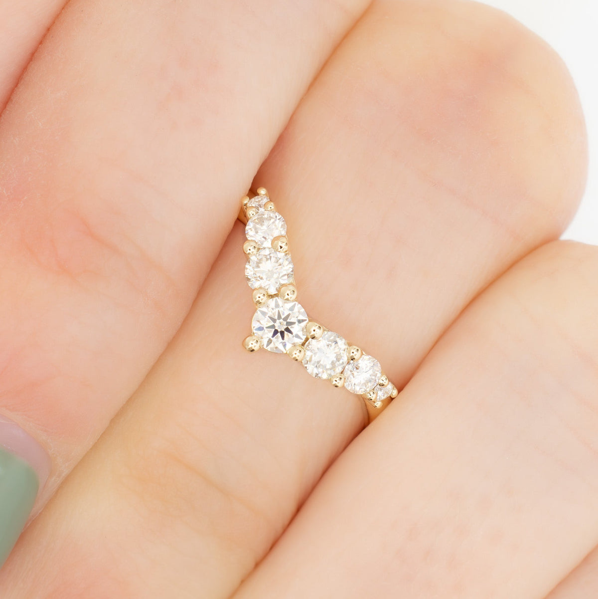 stella contour band in yellow gold with moissanite accents