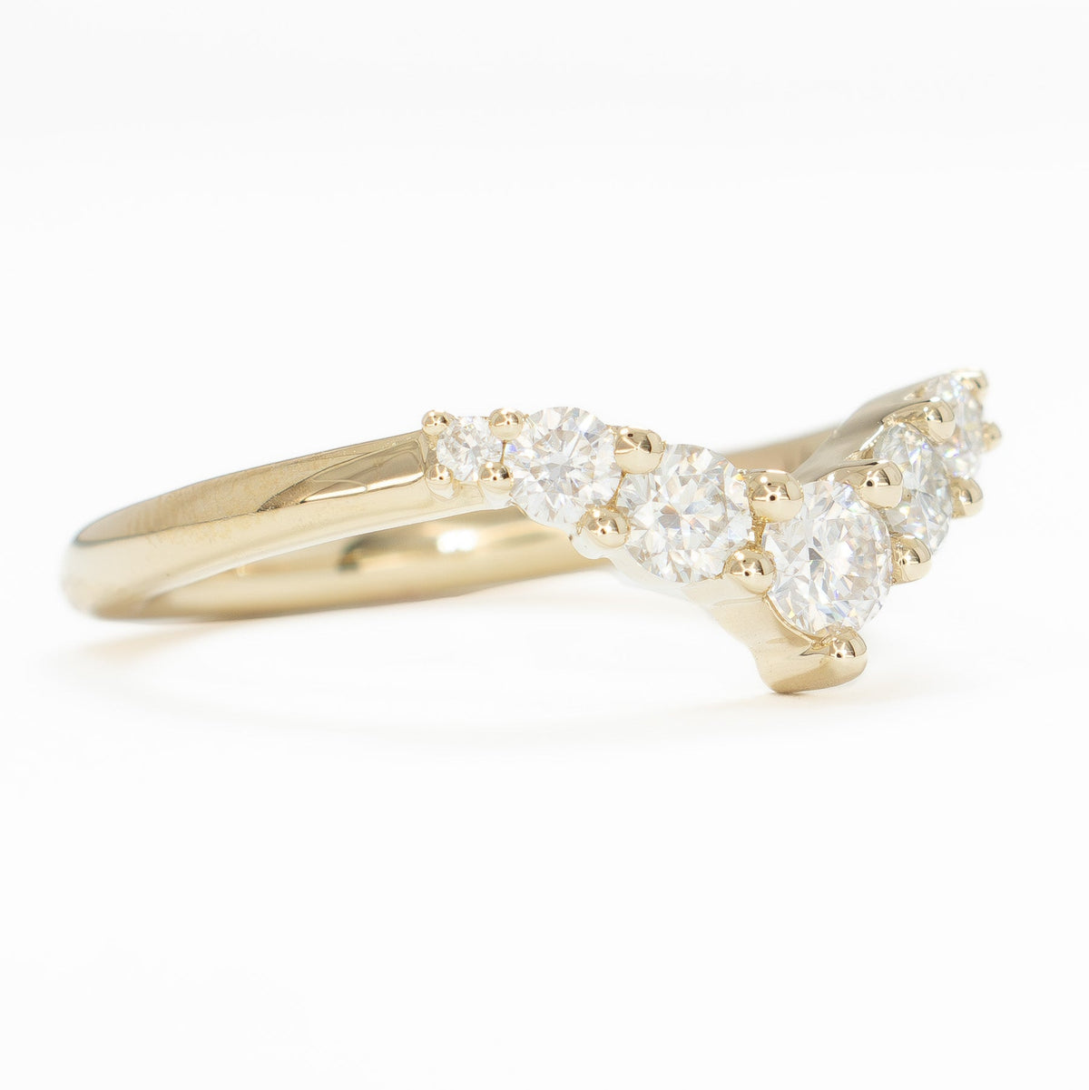 stella contour band in yellow gold with moissanite accents