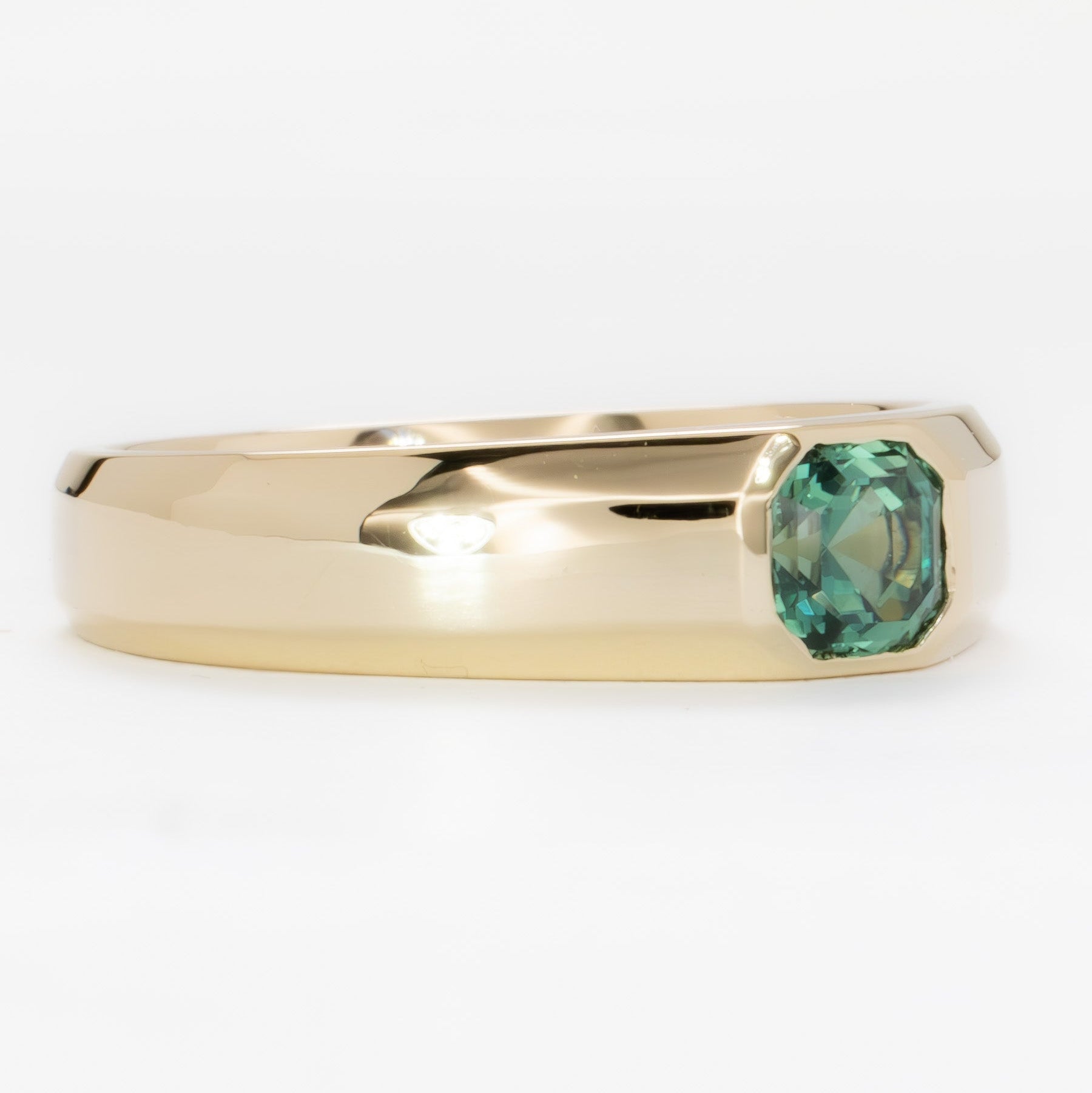 stevie flush set ring in yellow gold with green lab sapphire asscher