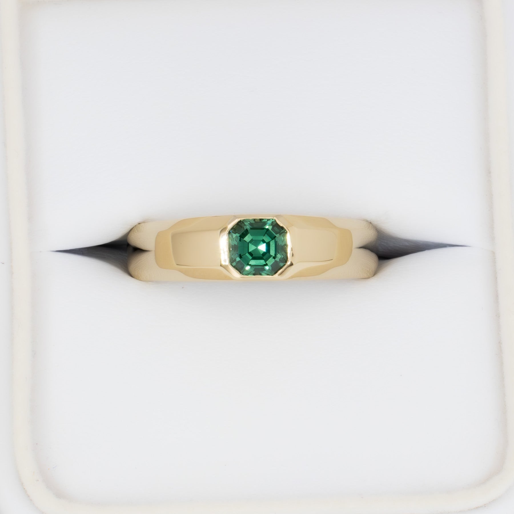 stevie flush set ring in yellow gold with green lab sapphire asscher