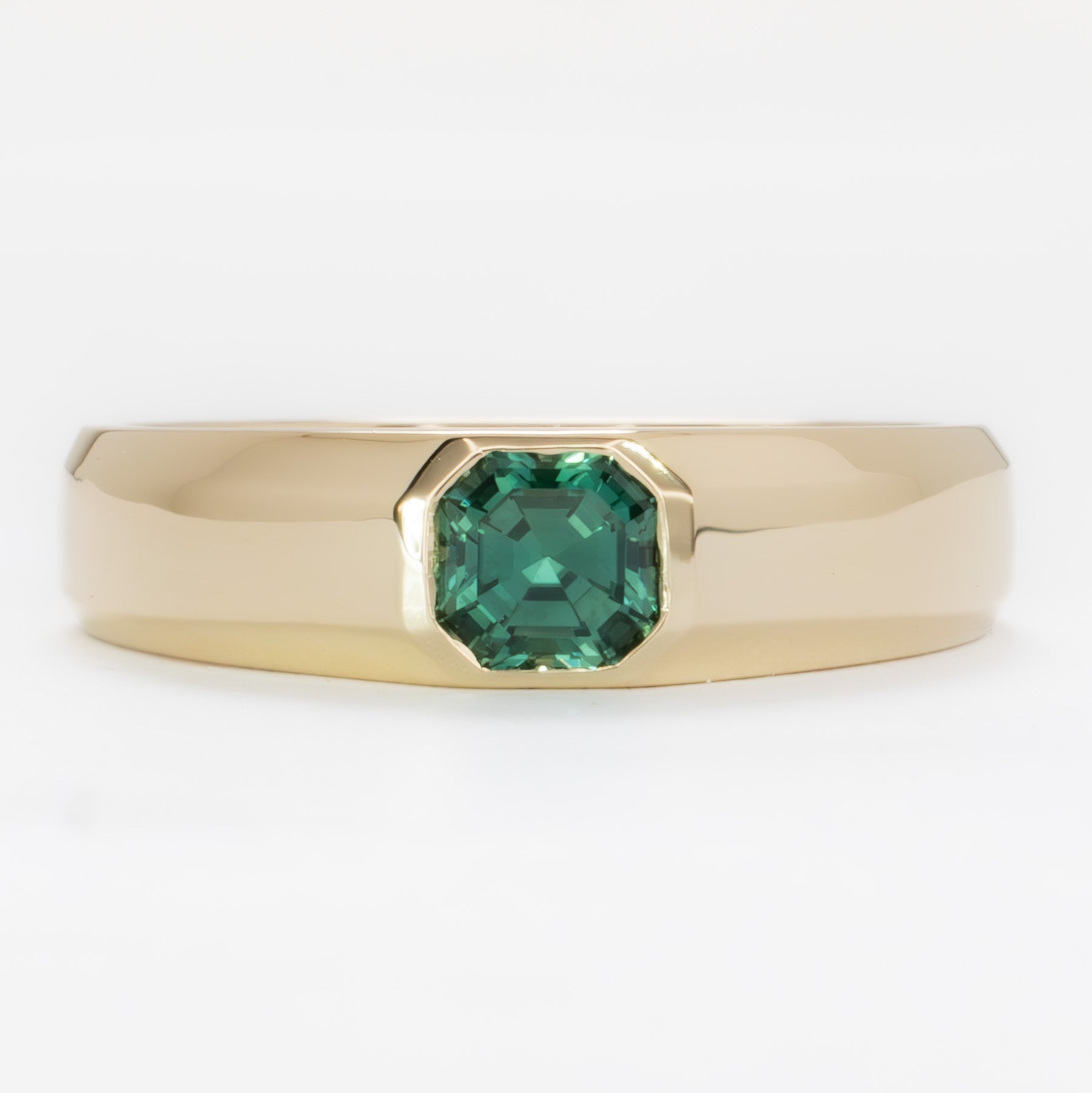 stevie flush set ring in yellow gold with green lab sapphire asscher