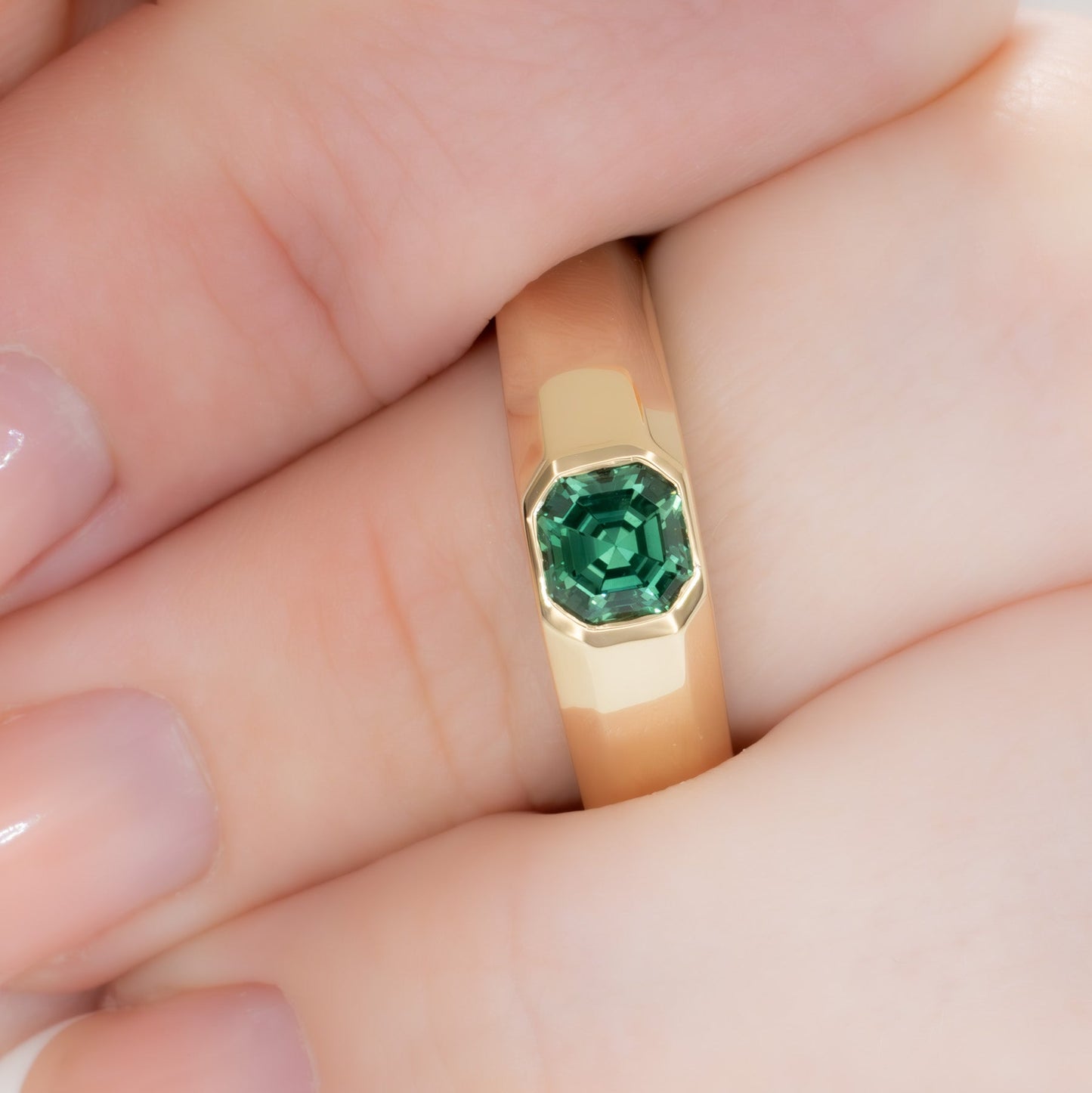 stevie flush set ring in yellow gold with green lab sapphire asscher