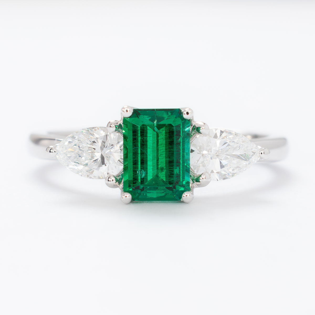tawnee three stone ring in white gold with step cut lab emerald